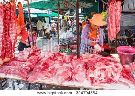 Bangkok, Thailand - January 5th 2010: Meat Vendor On Khlong Toei Market, The Market Is The Largest W