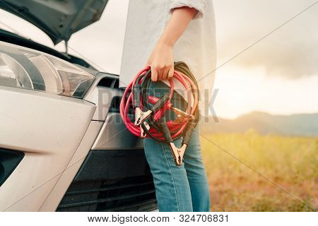 Close Up Woman Connecting Battery Cable Copper Wire For Jumper Repair And Maintenance Electric Of En