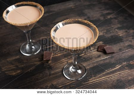 Chocolate Martini Cocktail In Glasses On Dark Wooden Background, Copy Space.