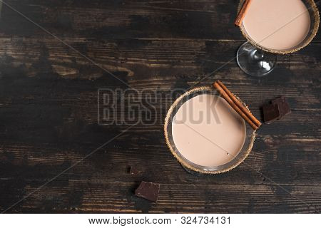 Dark Chocolate Martini Cocktail In Glasses On Dark Wooden Background, Copy Space.