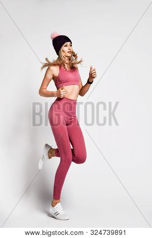 Sexy Blonde Woman With Perfect Athletic Slim Figure By Physical Education Or Fitness, Leads A Health
