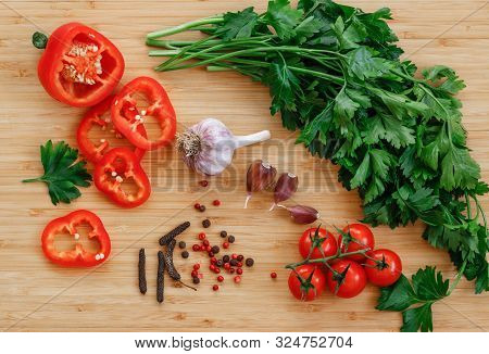 Fresh Vegetables On The Table. Food Background. Flat Lay. Cherry Tomatoes, A Bunch Of Parsley, Chopp