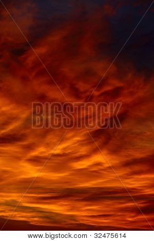 Dramatic sunset sky with clouds glowing red