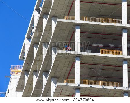 Belgrade, Serbia, September 27, 2019. Construction Worker At Kyscraper Construction Site. Finishing 