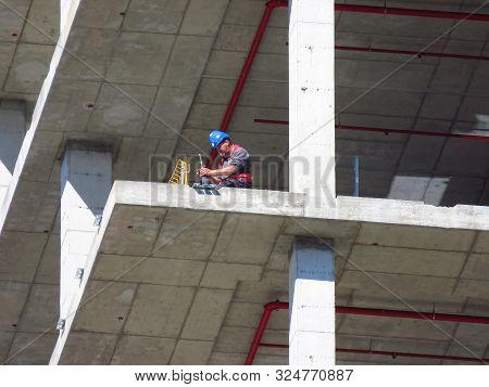 Belgrade, Serbia, September 27, 2019. Construction Worker At Kyscraper Construction Site. Finishing 