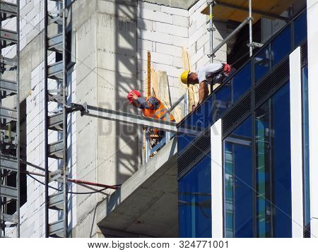 Belgrade, Serbia, September 27, 2019. Construction Worker At Kyscraper Construction Site. Finishing 