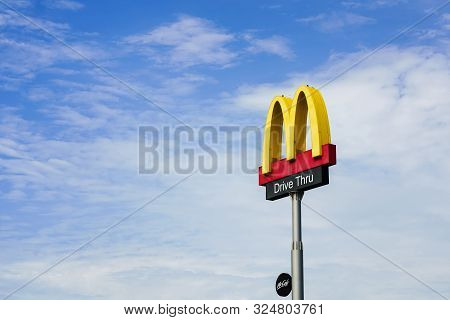 Samut Prakan, Thailand-september 12, 2019 : Mcdonalds Logo And Drive Thru Sign With Blue Sky In Fron