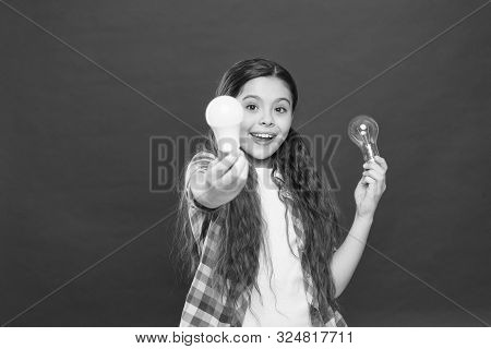 Idea And Brainstorming Concept. Girl Adorable Child With Long Hair Hold Light Bulbs. Idea And Creati