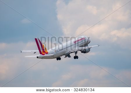 Zurich, Switzerland - July 19, 2018: Germanwings airlines company airplane flying in cloudy sky