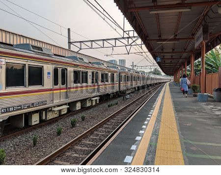 Jakarta, Indonesia - August 13, 2019: A Commuter Line Train Arrives At Bojong Indah Station.