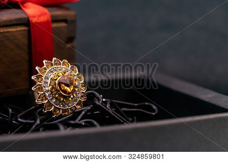 Traditional Ring Gift Concept. Close View Of Cocktail Ring In A Black Box And Wooden Gift Box With R