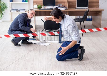 Forensic investigator investigating theft in the office