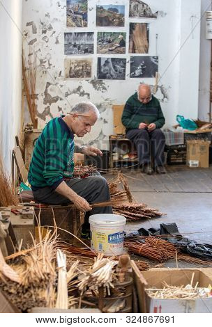 Camacha, Madeira, Portugal - April 19, 2018: A Basket Weaver At Work In The Factory Shop In Camacha 
