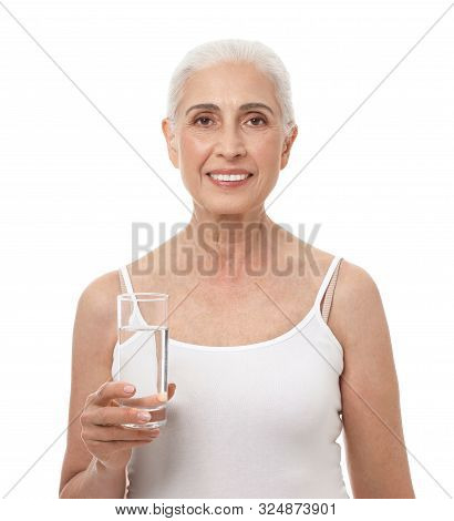 Portrait Of Beautiful Mature Woman With Glass Of Water On White Background