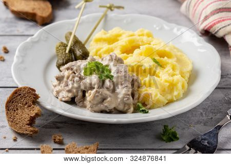 Beef Stroganoff, Traditional Russian Dish Of Goulash With Beef In Creamy Sauce, Mashed Potatoes And
