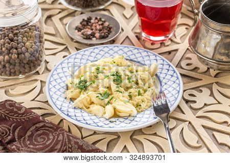 Conchiglie Pasta Italian Pasta Shells With Melted Cheese And Glass Of Red Drink On Oriental Wooden T