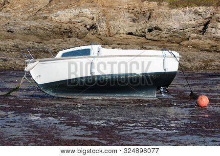 Boat Grounded At Mooring During Low Tide In Brittany