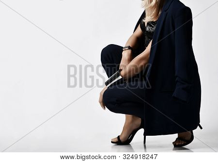 Closeup Portrait In Profile Of Glamorous Woman Blonde In Velvet Bralet, Blue Jacket And Pants, High 