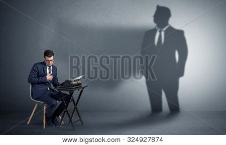 Shadow threatening hard worker man who is afraid