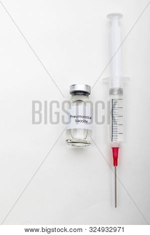 Medical Concept Showing Medical A Medical Vial Reading Pneumococcal Vaccine And A Syringe