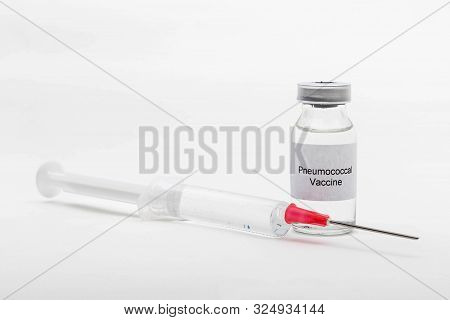 Medical Concept Showing Medical A Medical Vial Reading Pneumococcal Vaccine And A Syringe