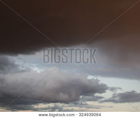 Dramatic Sky Before The Rain With An Impending Black Cloud. Background.