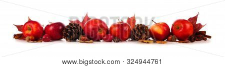 Autumn Border Of Apples, Leaves, And Fall Decor. Side View Isolated On A White Background.