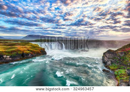 Fantastic Sunset Scene Of Powerful Godafoss Waterfall. Dramatic Sky Over Godafoss. Location: Bardard