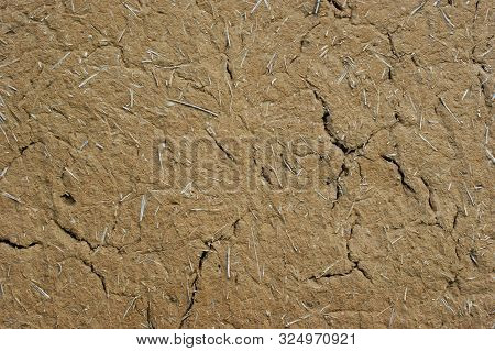 Old Wall Of A Combination Of Red Clay And Straw