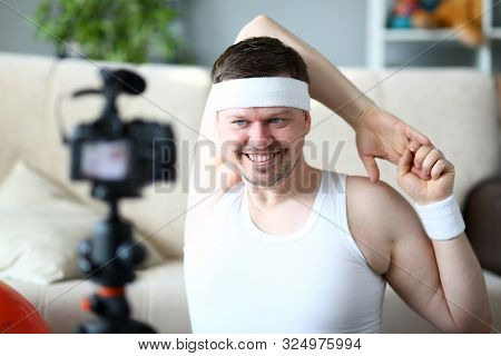 Man Vlogger Doing Exercise For Hands Portrait. Happy Sportsman Recording Fitness Training On Digital