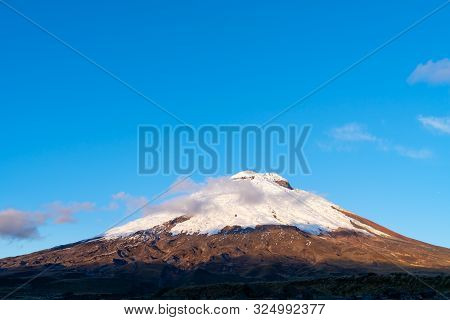 The Majestic Cotopaxi Volcano With The Santo Domingo Lagoon.