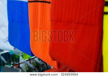 Multi-colored Socks Folded In Brightly Colored Wardrobes, Neatly Dressed, Shelves And Colorful Cloth