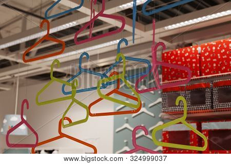 Umea, Sweden - August 31, 2019: Lots Of Clothes Hangers Hanging From The Roof Of Ikea