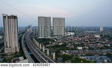 Aerial View Of Highway Intersection And Buildings In The City Of Bekasi And Noise Cloud With Bekasi 