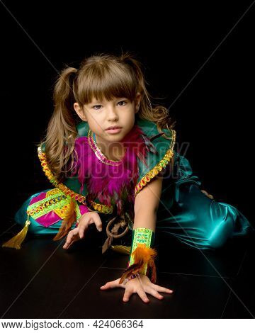 Pretty Little Girl Crawling On Floor. Portrait Of Beautiful Preteen Girl Dressed Bright Ethnic Costu