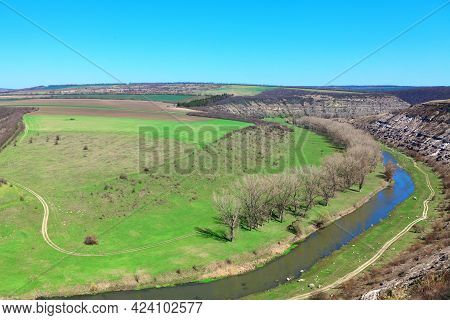 River Hills And Green Meadows . Aerial View Of Springtime Nature. Riverside Panorama