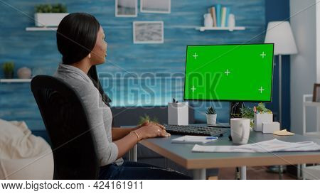 African American Student Sitting At Desk Working Remote From Home During Virtual Videocall Meeting C