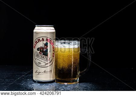 Can Of Birra Morreti Beer And Beer Glass On Dark Background. Illustrative Editorial Photo Shot In Bu