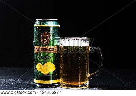 Can Of Perlenbacher Radler Beer And Beer Glass On Dark Background. Illustrative Editorial Photo Shot