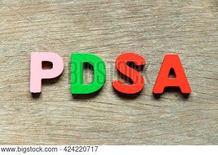Color Alphabet Letter In Word Pdsa (abbreviation Of Plan Do Study Act) On Wood Background