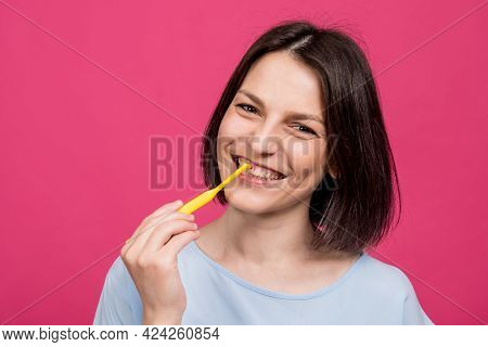 Beautiful Happy Young Woman With Single Tufted Toothbrush On Blank Pink Background