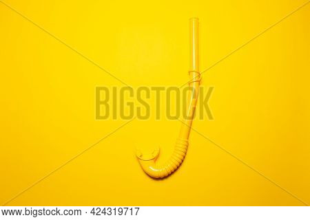 Close-up Of Diving Snorkel On Yellow Background.