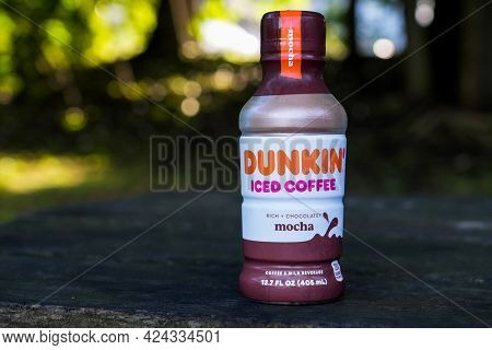 NORWALK, CT, USA - JUNE, 20, 2021: Dunkin Iced Coffee bottle  on table