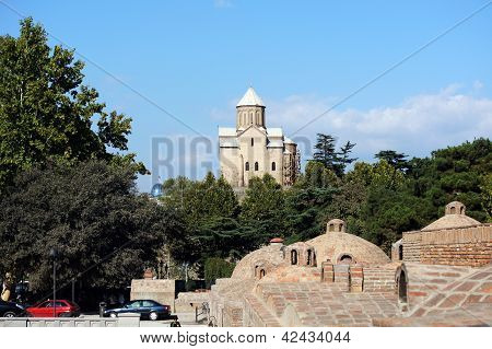 One Of The Old Tbilisi Symbol - Metekhi Church And Domes Of Ancient Sulfuric Baths