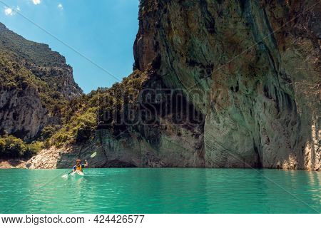 Man on a kayak on the waters of the Mont Rebei Gorge in Catalonia