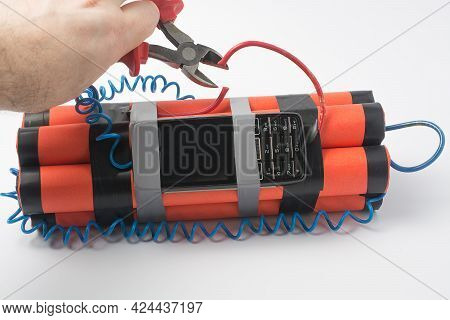 A Man With Side Cutters Wants To Cut The Red Wire On The Bomb So That An Explosion Does Not Occur. S
