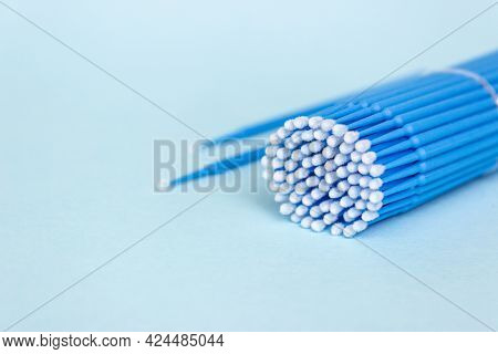 Blue Microbrushes, Small Brushes For Cleaning Eyelashes And Teeth. Blue Background. Dentistry, Eyela