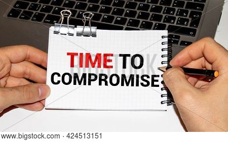 Text Time To Negotiate On The Page Of A Notepad Lying On Financial Charts On The Office Desk. Near T