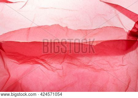Red single-use plastic bag waste