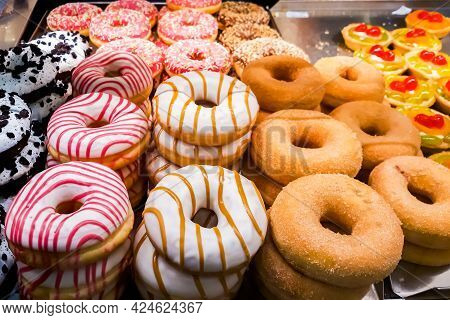 Tasty Sweets In Window Of Confectionery Store. Fresh Pastries, Donuts, Cakes